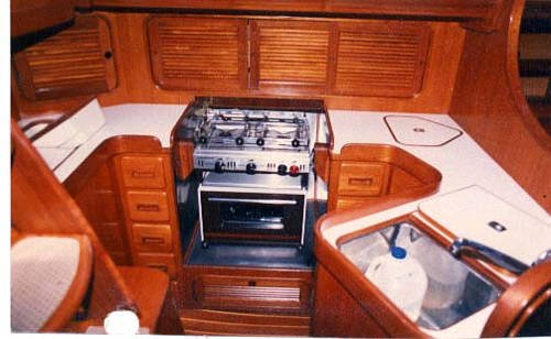 This is the galley of the Baba 35.  Efficiently designed with Formica
    counter tops and plenty of storage, it's a pleasure to prepare meals and entertain guests.