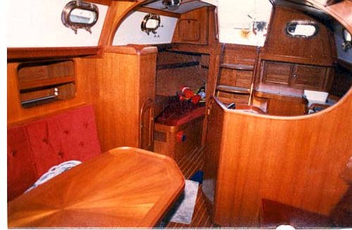 This is the salon looking aft from the port side, forward.  Beautiful
    teak throughout the boat.