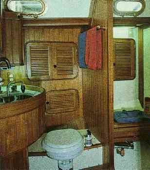 The head of the Baba 40 with separate shower is entered from the
    passageway between the main cabin and the V-berth.
