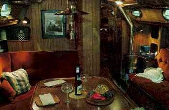 The main salon is spacious and beautiful. The rich teak finish throughout
    the cabin creates an inviting atmosphere for crew and guests.